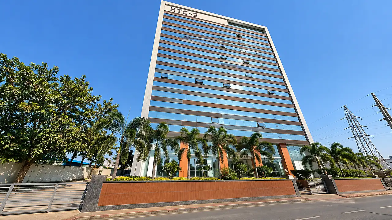 Exterior facade and modern glass front of HTC 2 Market (Hindustan Textile Centre 2) on BRTS Canal Road in Dumbhal, Surat