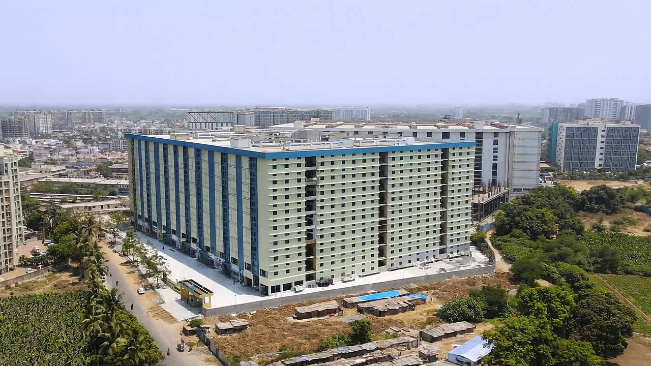 Aerial view of Radha Raman Textile Market RRTM 2 in Saroli Surat showing a large multi-floor textile wholesale complex