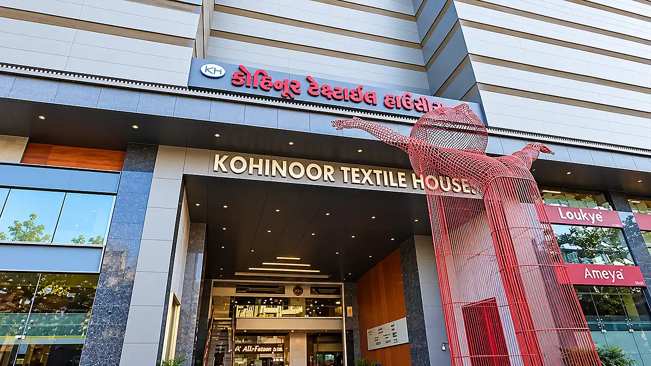 Grand entrance gate and red metal wire sculpture of Kohinoor Textile Houses in Surat